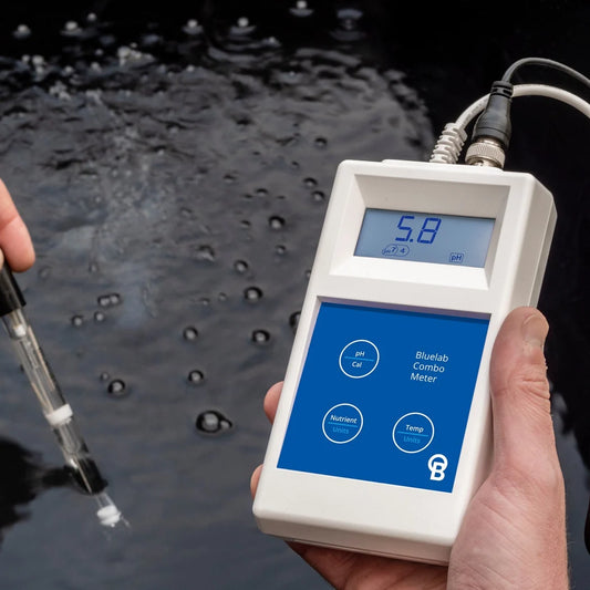 Bluelab Combo Meter measuring pH in a nutrient reservoir with the replaceable Bluelab pH probe