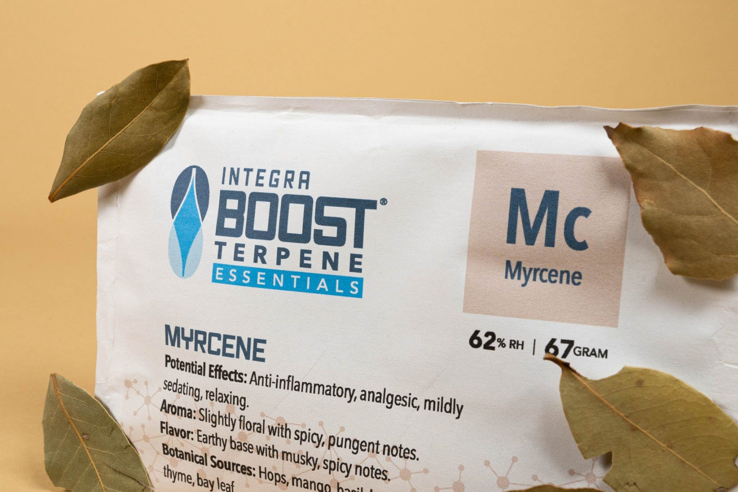 Integra Terpene Essentials 67g Myrcene 62% Relative Humidity master case of 96 packs Close Up With Herbs View