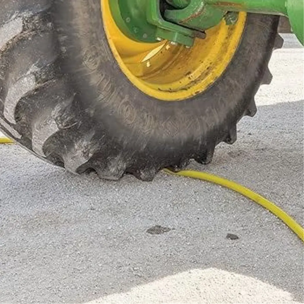 Dramm ColorStorm Yellow Hose 5/8 - 100 Ft. Under Tractor Tire