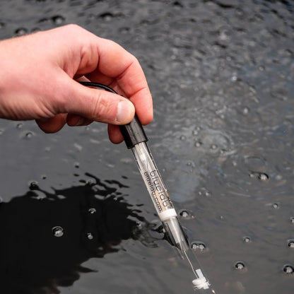 Bluelab pH probe being dipped into a nutrient reservoir to take a reading
