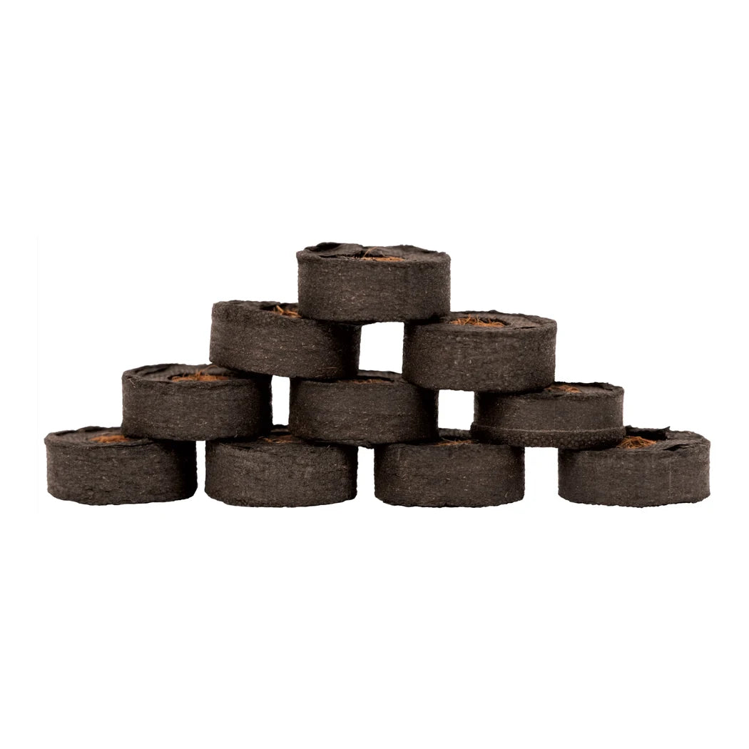 Compressed Botanicare CocoPro plugs stacked in a pyramid