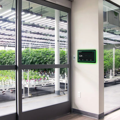 Growlink displayLINK wall mounted in the hallway outside a glass-walled mother room