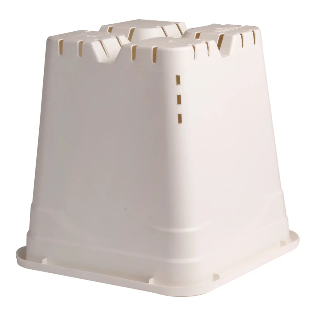 Underside of the square white pot showing the raised feet and drainage slots