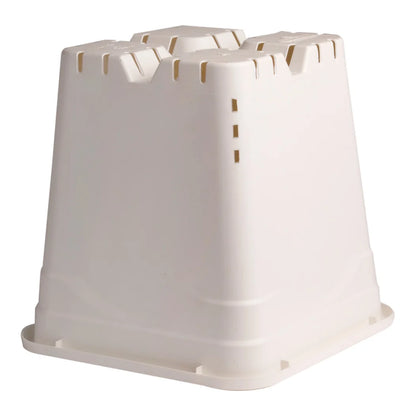 Underside of the square white pot showing the raised feet and drainage slots
