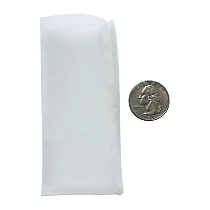 Press Club 2 x 4 rosin bag next to a quarter for scale