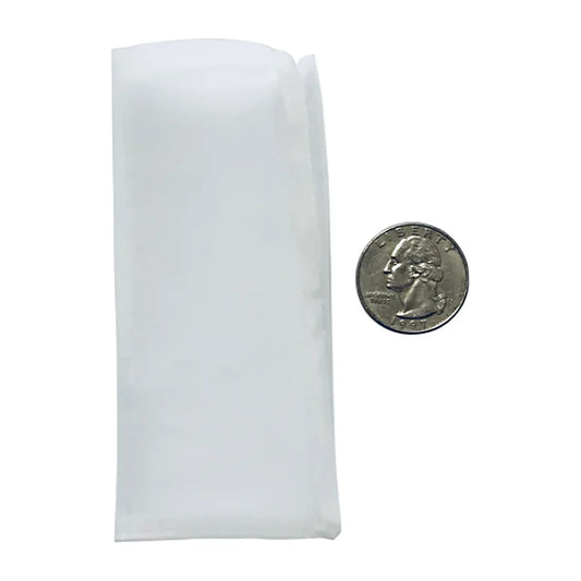 Press Club 2 x 4 rosin bag next to a quarter for scale